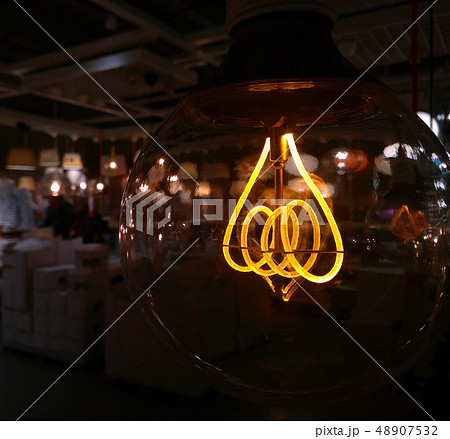 Edison's lamp spiral shines with a faint light 48907532
