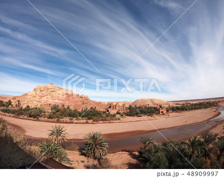 Wide angle view of the fortified village of Ait Ben Haddou with incredible clouds, near Ourzazate 48909997