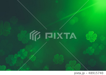 St. Patrick's Day green Shamrock Leaves background. Patrick's Day backdrop with growing clover leaf 48915740