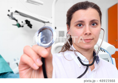 Female doctor with stethoscope in clinic office 48915988