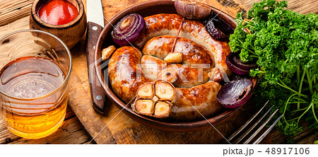 Grilled sausages on wooden table Grilled sausages on wooden table 48917106