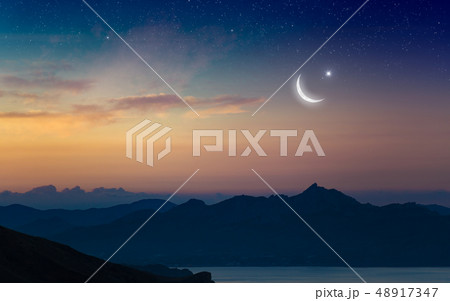 Ramadan Kareem background with crescent and stars Ramadan Kareem background with crescent and stars 48917347