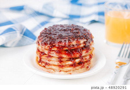 Pancakes with jam on plate on tabl Pancakes with jam on plate on tabl 48920291