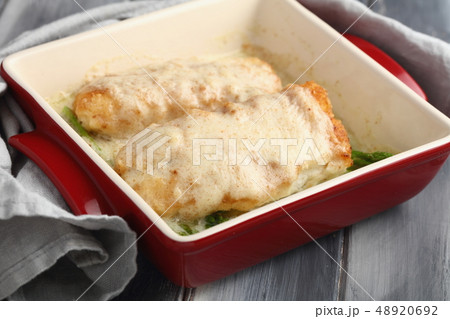 Baked haddock fish with vegetables 48920692