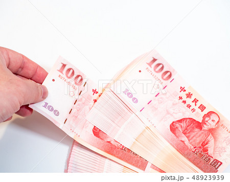 Hand holding taiwan dollars 48923939