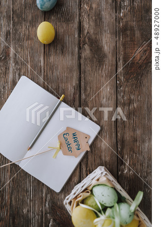 Easter decor and copybook on kitchen table Easter decor and copybook on kitchen table 48927000