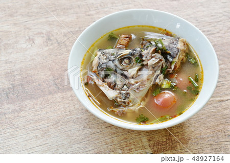 spicy boiled Tilapia head fish in tom yum soup spicy boiled Tilapia head fish in tom yum soup 48927164