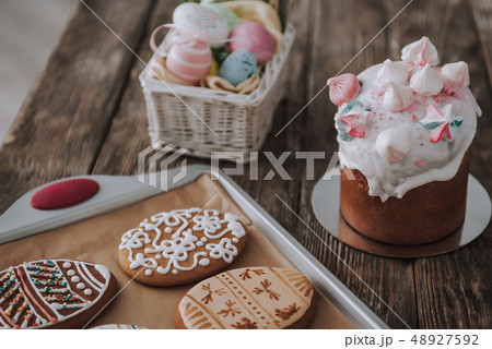 Close up Easter bakery and eggs on kitchen table Close up Easter bakery and eggs on kitchen table 48927592