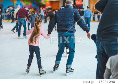 LVIV, UKRAINE - February 3, 2019: people skating on ski rink in city mall 48931098