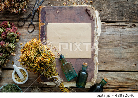Old book, tincture, medicinal herbs. Old book, tincture, medicinal herbs. 48932046