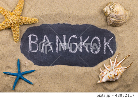 Handwritten word BANGKOK written in chalk, among 48932117