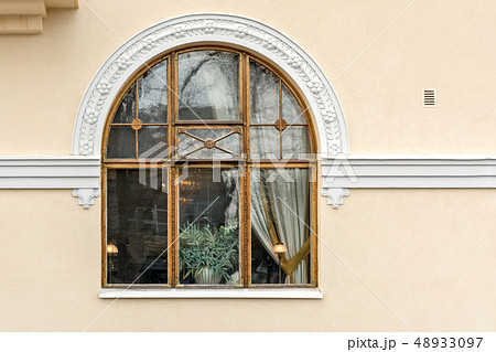 Arched window on beige. Arched window on beige. 48933097