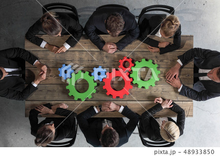 Business people with cogs of business 48933850