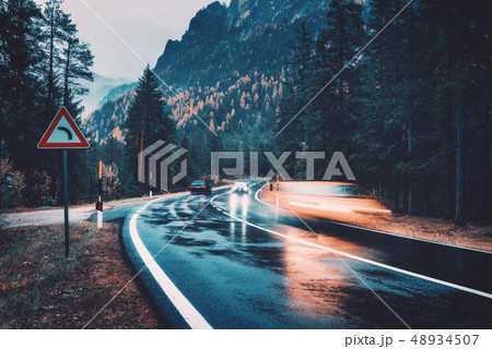 Blurred cars in motion on the road in autumn 48934507