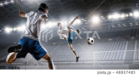 Soccer player hitting ball Soccer player hitting ball 48937485