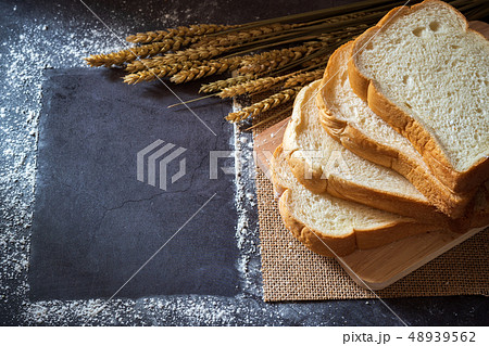 Bread on wooden cutting board and copy space frame Bread on wooden cutting board and copy space frame 48939562