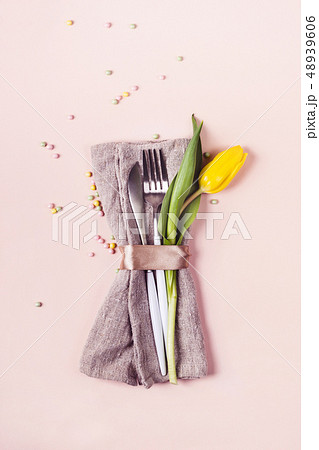 Cutlery is decorated with beautiful yellow tulip 48939606
