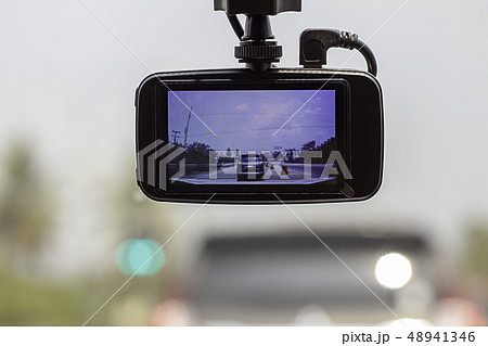 Picture cars and sky on camera in car. Picture cars and sky on camera in car. 48941346