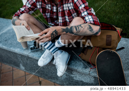 Close up of a book in hands of a young man 48941433