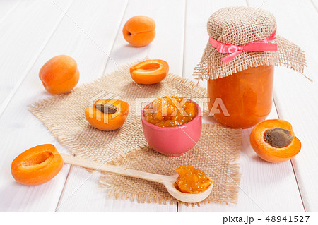 Fresh prepared apricot marmalade and ripe fruits Fresh prepared apricot marmalade and ripe fruits 48941527