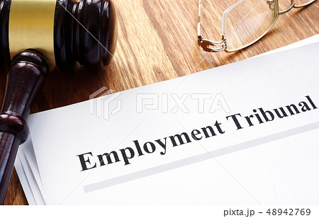 Employment tribunal documents with pen on table. Employment tribunal documents with pen on table. 48942769