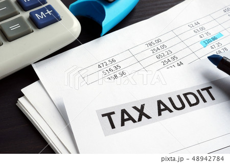 Tax audit. Financial report on a desk. Tax audit. Financial report on a desk. 48942784
