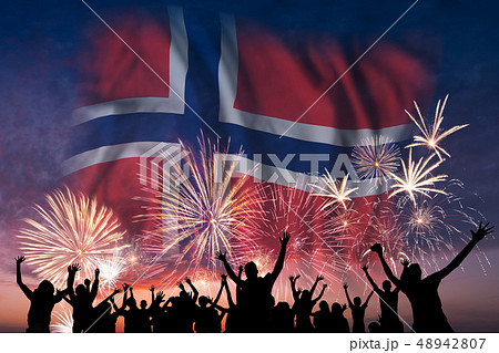 People are looking on fireworks and flag of Norway People are looking on fireworks and flag of Norway 48942807