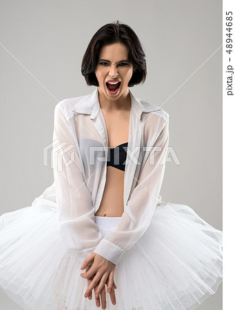 Emotional brunette in ballet tutu portrait 48944685