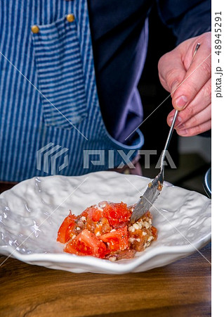 Chef decorates the dish from Vegan tomatoes 48945291