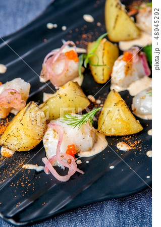 Smoked catfish and baked quince. European cuisine 48945292