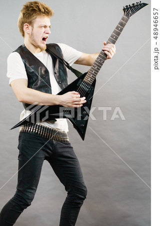 Man playing rock on electric guitar 48946657