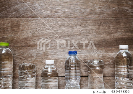 Drinking water bottle on grunge vintage wooden 48947306