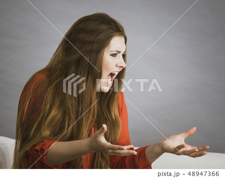 Angry woman complaining 48947366