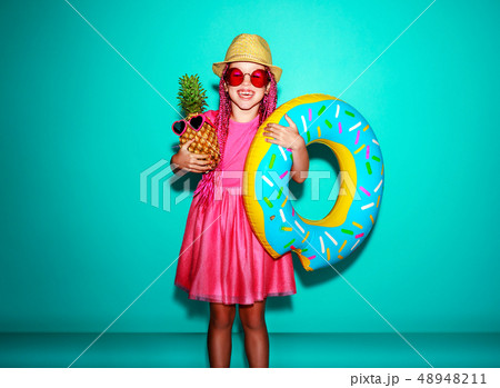 Funny happy child girl in summer pink dress 48948211