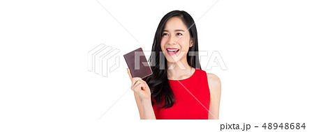 Beautiful smiling Asian woman holding passport 48948684