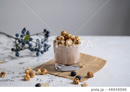Cocoa with chocolate popcorn on a white table. 48948996