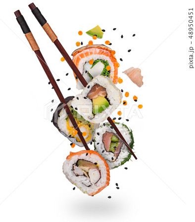 Pieces of delicious japanese sushi frozen in the air. 48950451