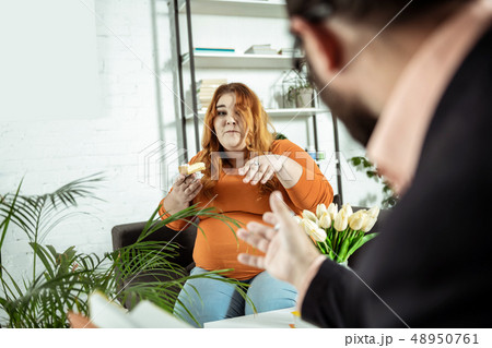 Serious young woman suffering bulimia since childhood Serious young woman suffering bulimia since childhood 48950761