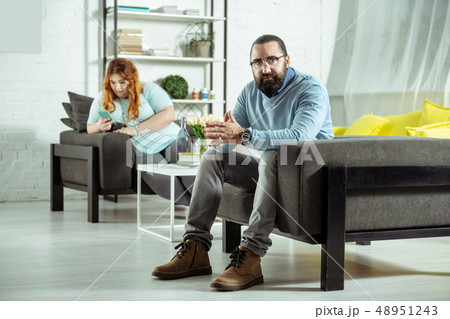 Serious bearded male person looking straight at camera 48951243