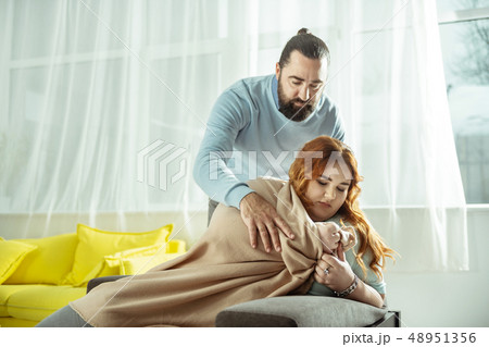 Upset overweight woman being deep in her thoughts 48951356