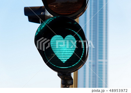Heart shaped traffic light on the street Heart shaped traffic light on the street 48953972