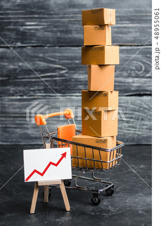 A supermarket cart loaded with lots of boxes  48955061