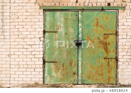 Green rusted metal door Green rusted metal door 48958024