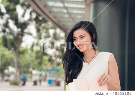 Lovely shopaholic in cafe 48958106