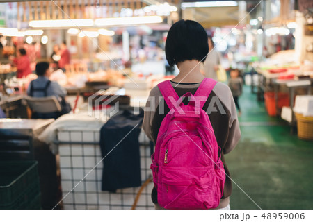 traveling woman in the traditional marketplace 48959006