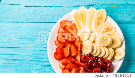 Plate with fresh fruits and berries Plate with fresh fruits and berries 48961613