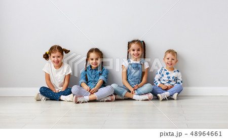 happy kids friends around empty walls. 48964661