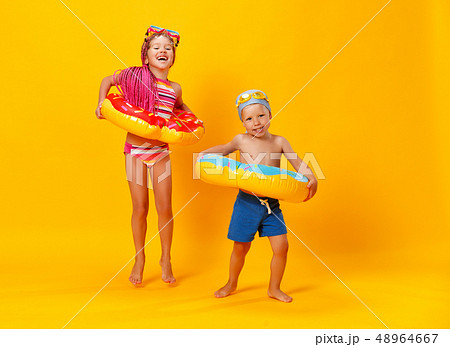happy children girl and boy in swimsuit with happy children girl and boy in swimsuit with 48964667