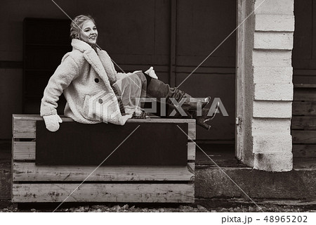 Russian beautiful girl at winter countryside 48965202