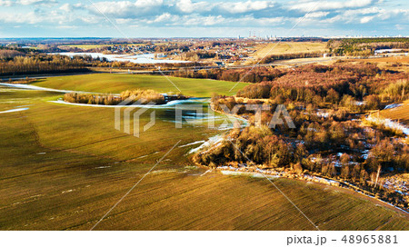 Spring melting snow on march agricultural fields. 48965881